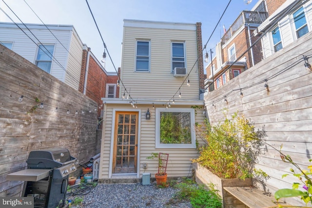 back of house featuring fence