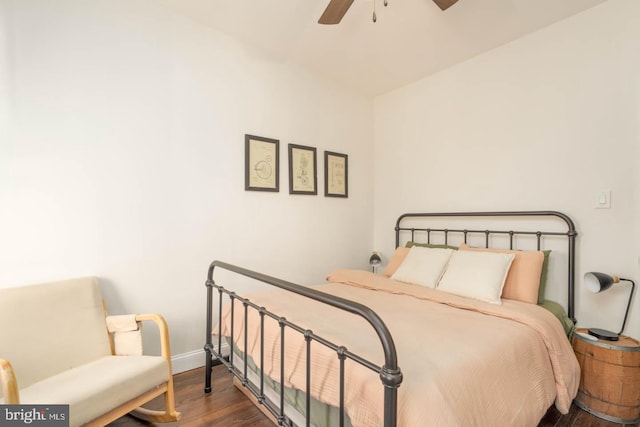 bedroom with baseboards, a ceiling fan, and wood finished floors