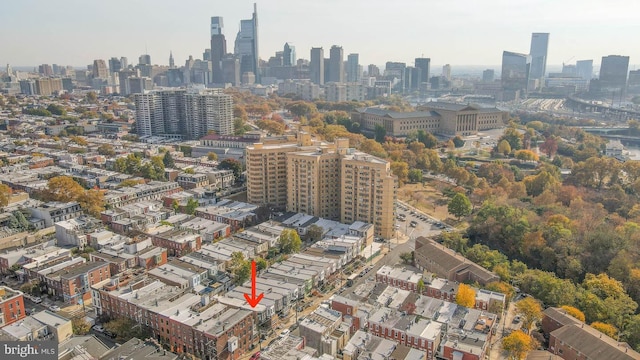 birds eye view of property with a view of city