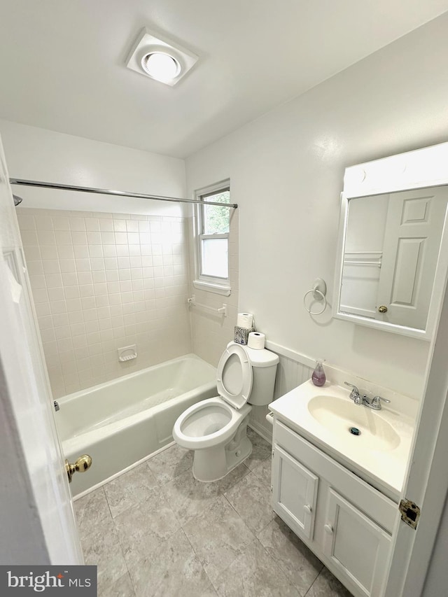 bathroom featuring vanity,  shower combination, and toilet