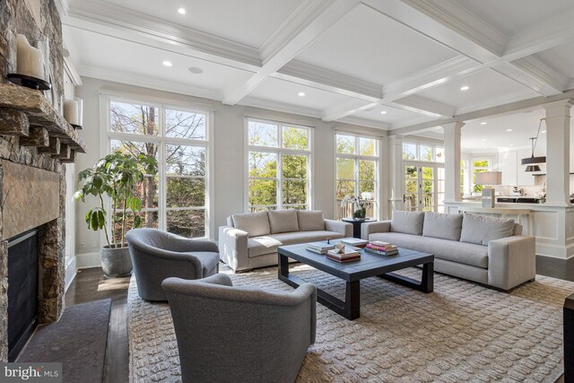 sunroom with french doors, coffered ceiling, beam ceiling, and a wealth of natural light