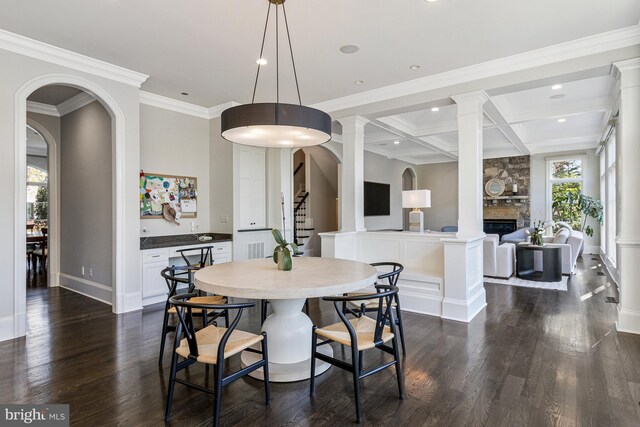 dining space with stairway, a fireplace, coffered ceiling, and dark wood-style floors