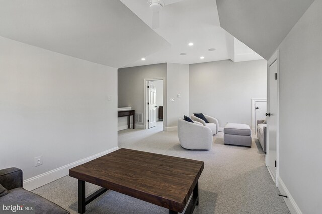 living area with baseboards, visible vents, recessed lighting, and light colored carpet
