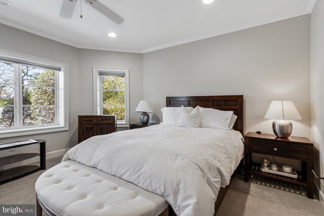 carpeted bedroom featuring crown molding, recessed lighting, baseboards, and ceiling fan