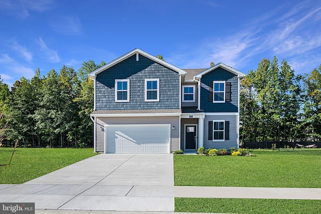 view of front of home with a garage, fence, driveway, and a front yard