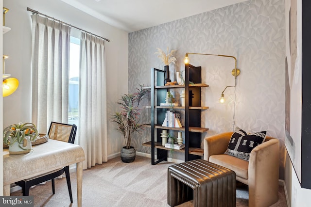 living area with baseboards, carpet, and wallpapered walls