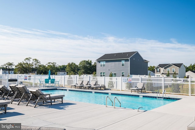 pool featuring a patio and fence