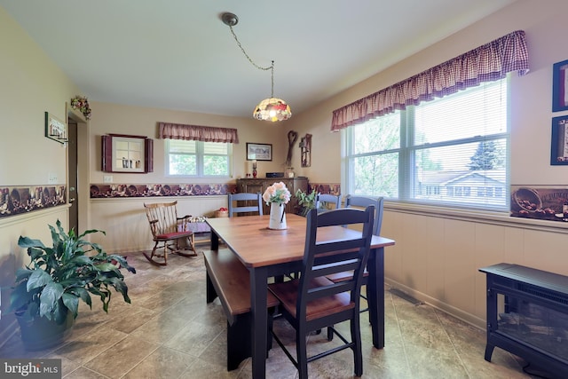 dining area featuring visible vents and wainscoting