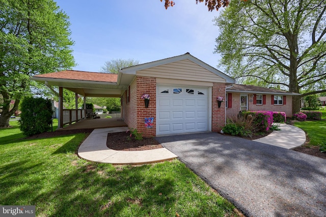 view of front of house with a garage, driveway, brick siding, and a front yard