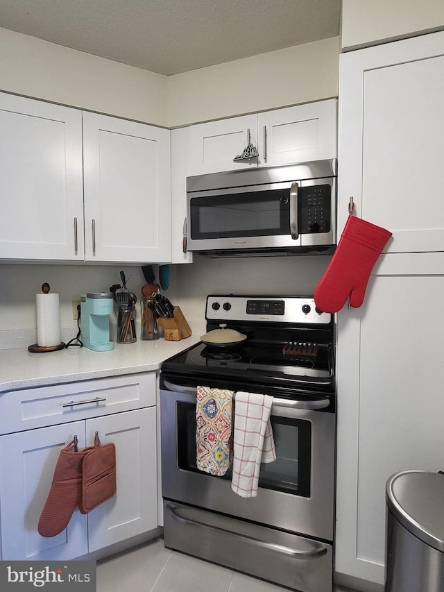 kitchen featuring light countertops, white cabinetry, and stainless steel appliances