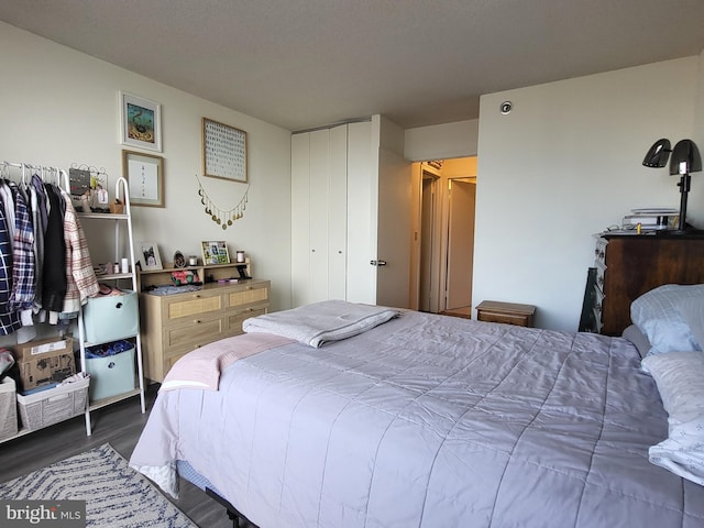 bedroom featuring dark wood-style floors