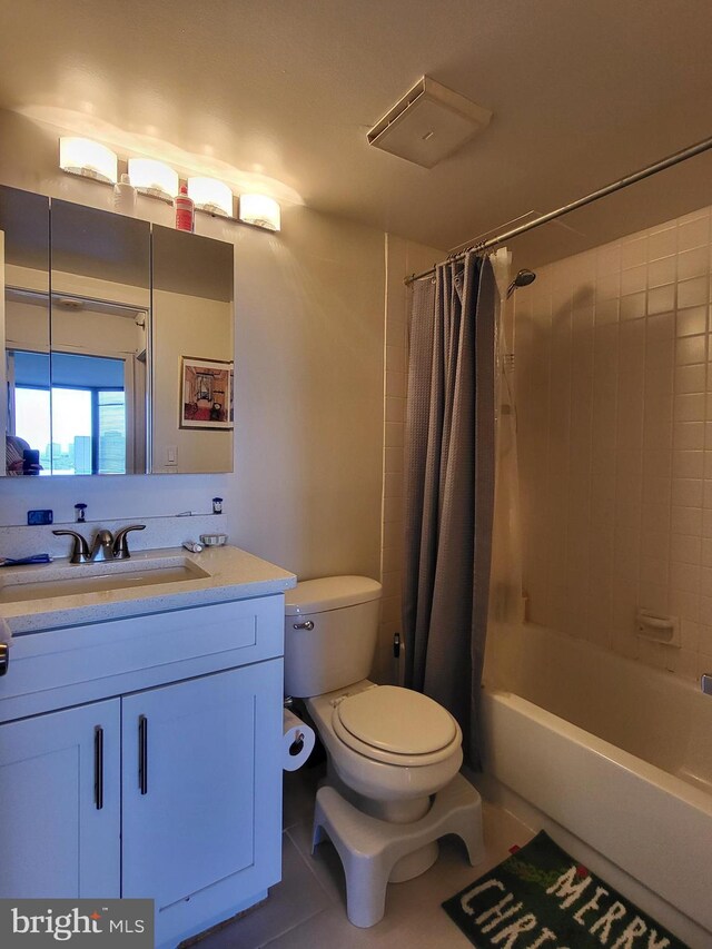 2020 Walnut St Unit 21K, Philadelphia, PA 19103 - full bathroom featuring tile patterned floors, shower / bath combo with shower curtain, vanity, and toilet