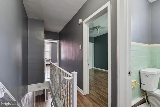 2062 E Stella St, Philadelphia, PA 19134 - interior space featuring tile walls, an upstairs landing, and wood finished floors