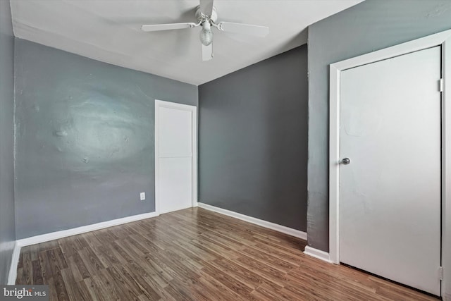 2062 E Stella St, Philadelphia, PA 19134 - unfurnished bedroom with baseboards, ceiling fan, and wood finished floors