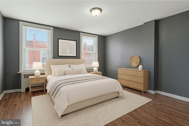 2062 E Stella St, Philadelphia, PA 19134 - bedroom featuring baseboards, wood finished floors, and radiator heating unit