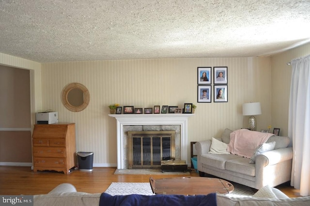 1837 Watson Rd, Abington, PA 19001 - living room featuring baseboards, a fireplace, a textured ceiling, and wood finished floors