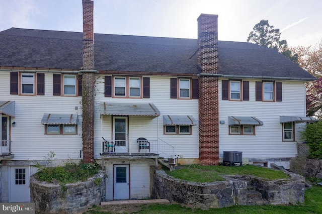 104 N Custer Ave, New Holland, PA 17557 - back of house featuring central AC and a chimney