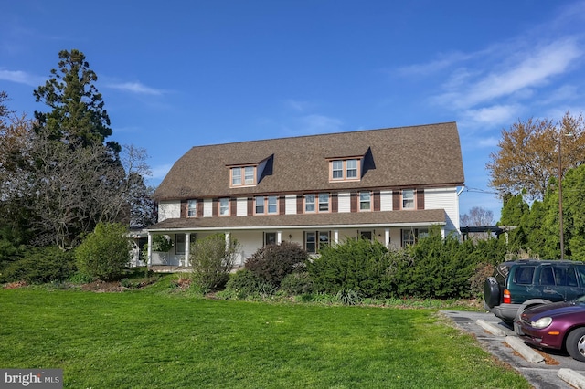 104 N Custer Ave, New Holland, PA 17557 - farmhouse inspired home with a porch, uncovered parking, and a front yard