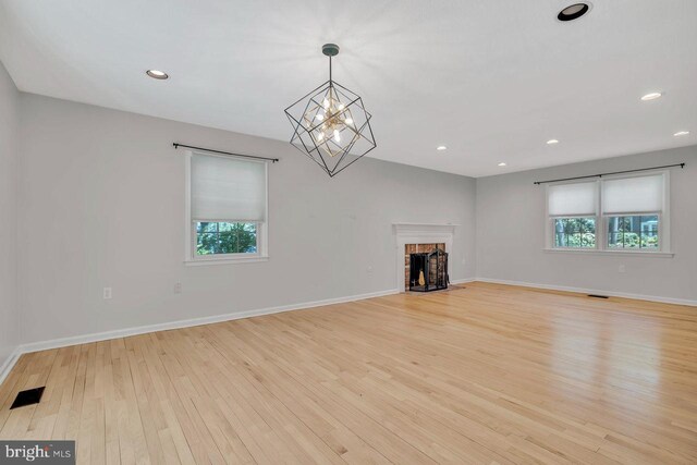 unfurnished living room with visible vents, recessed lighting, light wood-style floors, and plenty of natural light