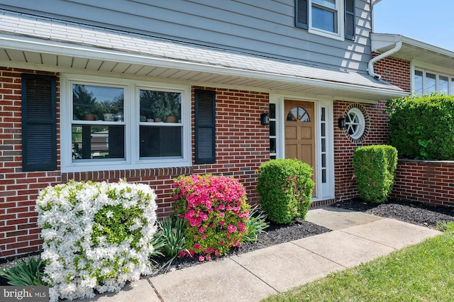 entrance to property with brick siding