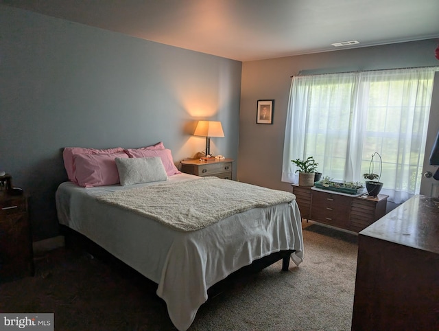 carpeted bedroom with visible vents