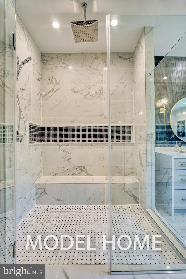full bath with a marble finish shower and recessed lighting