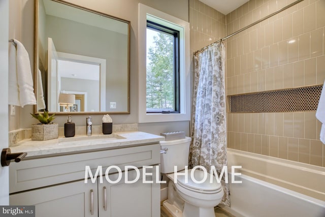 full bathroom with vanity, toilet, and shower / tub combo