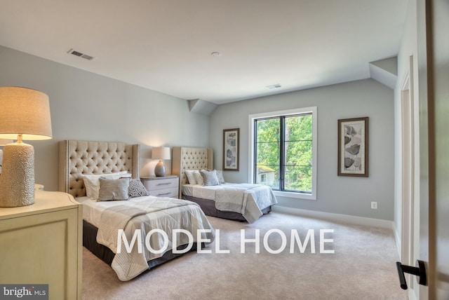 bedroom featuring baseboards, light carpet, and visible vents