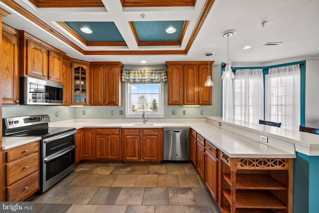 kitchen featuring brown cabinets, ornamental molding, stainless steel appliances, and a peninsula