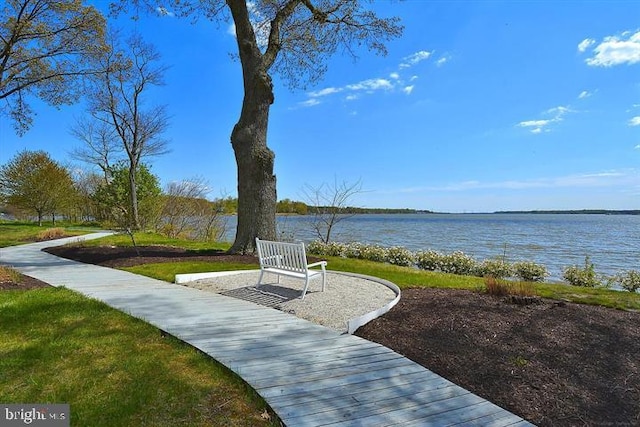 view of community with a water view