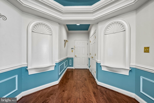 mudroom featuring wainscoting, dark wood finished floors, ornamental molding, and a raised ceiling