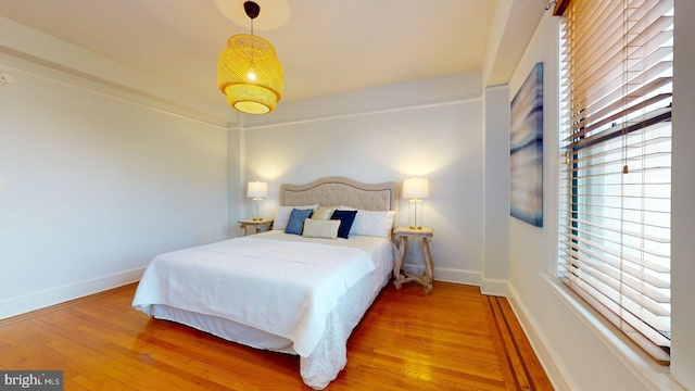 1613 Harvard St NW Unit 415, Washington, DC 20009 - bedroom featuring wood finished floors and baseboards