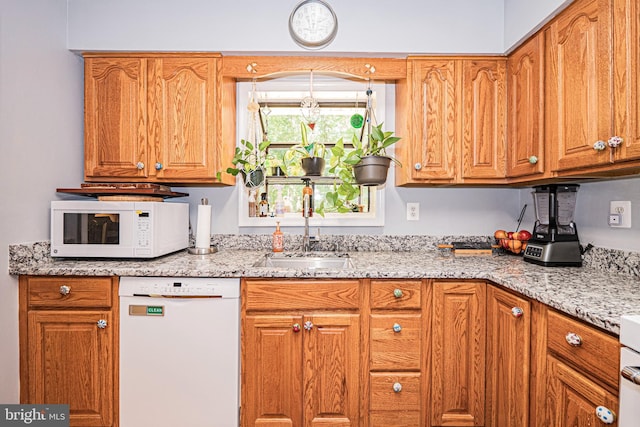 11039 Timberview Dr, Manassas, VA 20111 - kitchen with white appliances, a sink, light stone countertops, and brown cabinetry