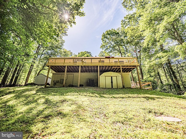 11039 Timberview Dr, Manassas, VA 20111 - back of house with a storage shed, a deck, an outbuilding, and a lawn