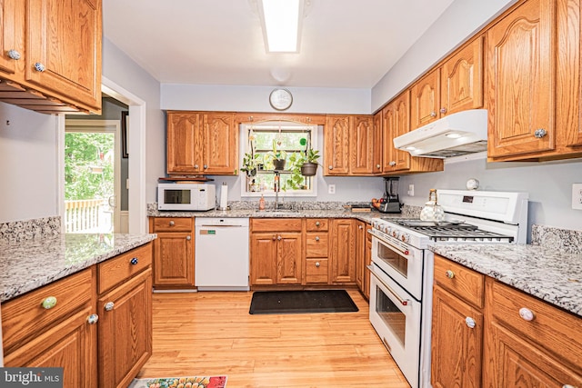 11039 Timberview Dr, Manassas, VA 20111 - kitchen featuring white appliances, under cabinet range hood, a sink, and light stone counters