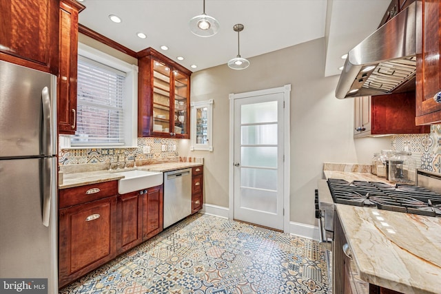 2410 S Camac St, Philadelphia, PA 19148 - kitchen featuring plenty of natural light, exhaust hood, decorative backsplash, appliances with stainless steel finishes, and baseboards