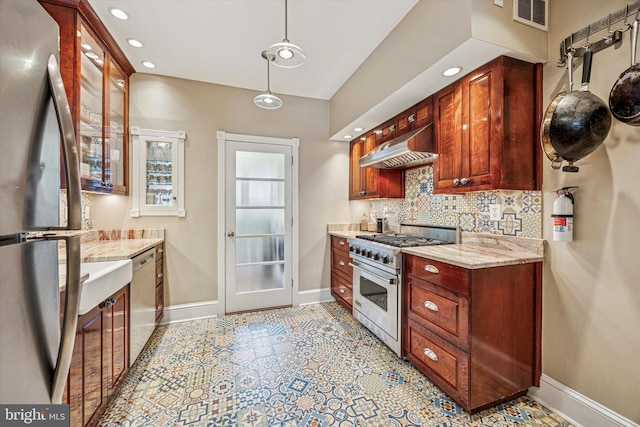 2410 S Camac St, Philadelphia, PA 19148 - kitchen featuring exhaust hood, appliances with stainless steel finishes, baseboards, decorative backsplash, and visible vents