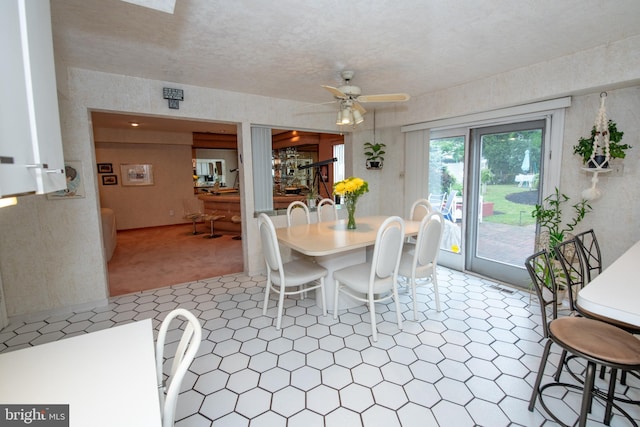 dining room with a ceiling fan