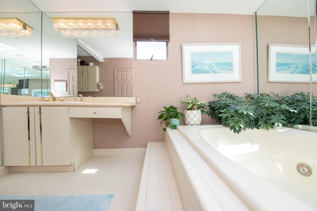 full bathroom featuring tile patterned flooring, a bath, vanity, and baseboards
