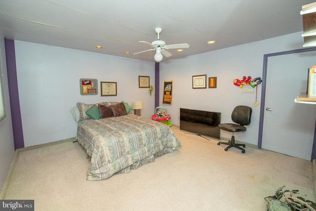 carpeted bedroom featuring recessed lighting and a ceiling fan