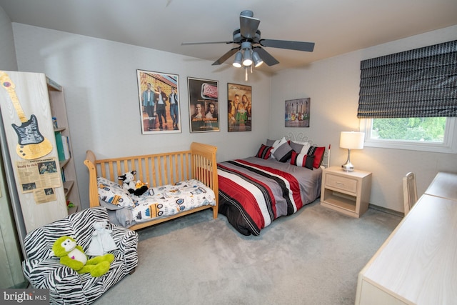 carpeted bedroom featuring a ceiling fan