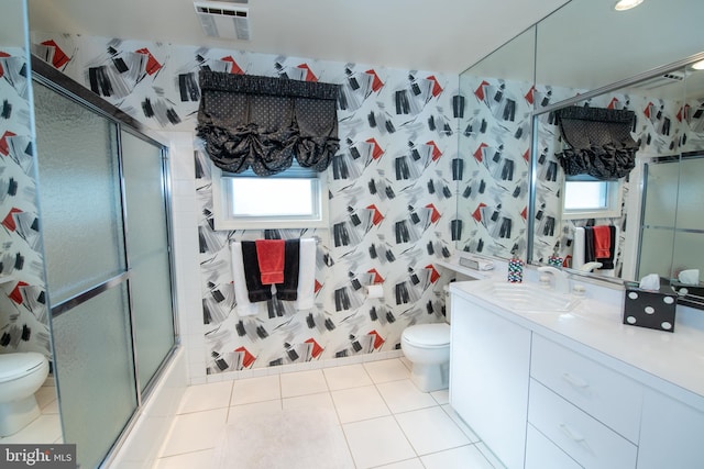 full bath featuring toilet, a shower with shower door, vanity, and tile patterned floors