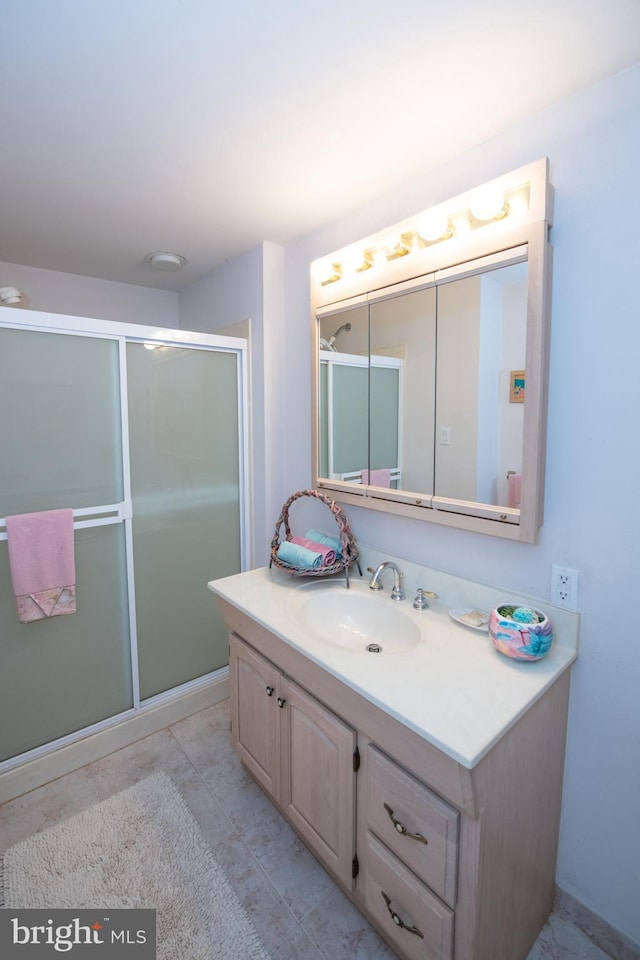 full bathroom featuring vanity and a stall shower