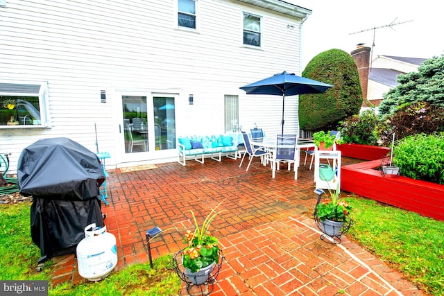 view of patio with a grill and outdoor dining space