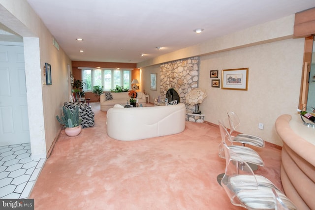 carpeted living area with a fireplace, recessed lighting, and baseboards