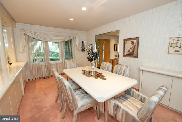 dining area with light carpet, wallpapered walls, and recessed lighting