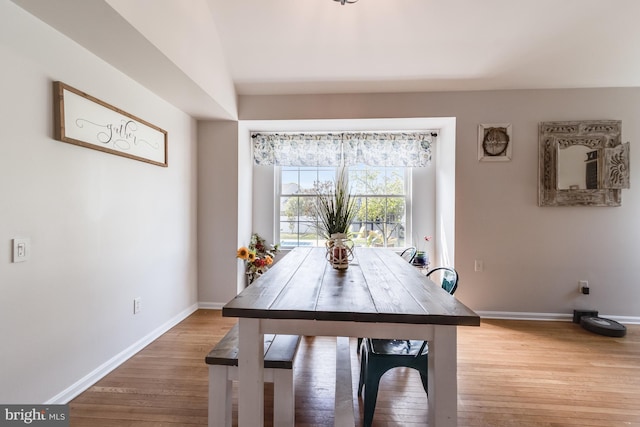 dining room with baseboards and light wood-style floors