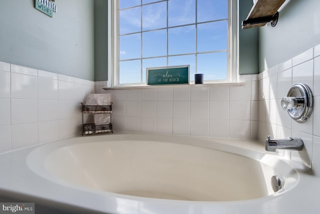 bathroom with a garden tub