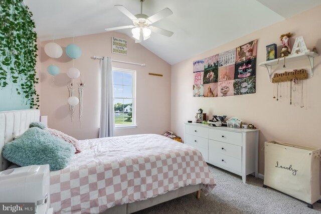 bedroom with a ceiling fan, light colored carpet, and lofted ceiling