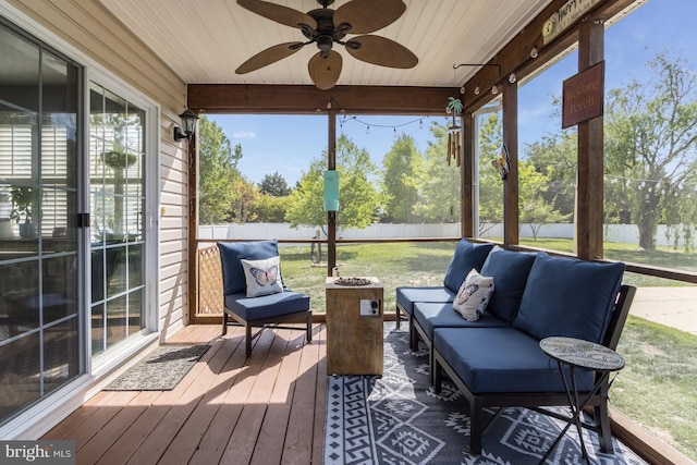 sunroom with an outdoor living space and ceiling fan